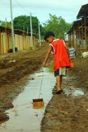 Openly flowing wastewater turns to be a playground for children. Source: SuSan Center (2012)